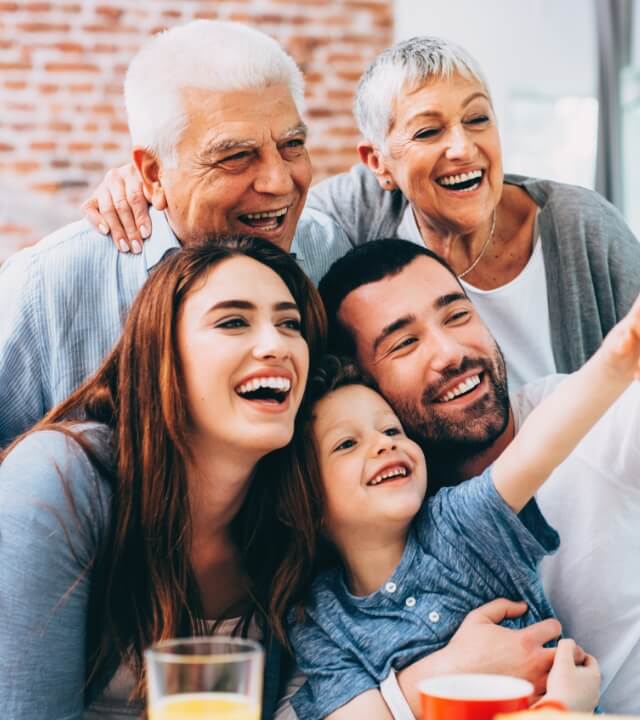 Multi-generational family taking selfie