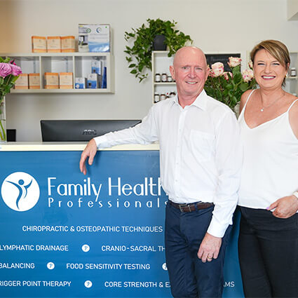 Dr Hennessey and wife at reception desk