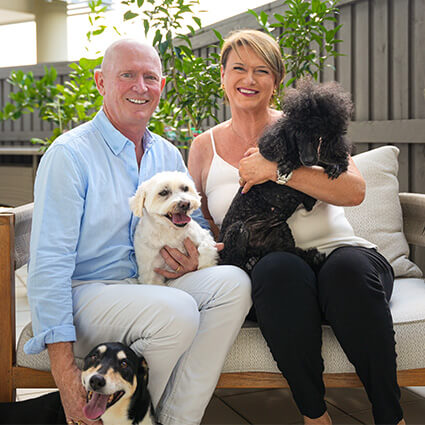Dr. Luke with wife and dogs