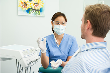 dentist speaking with patient