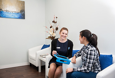 Staff consulting with patient