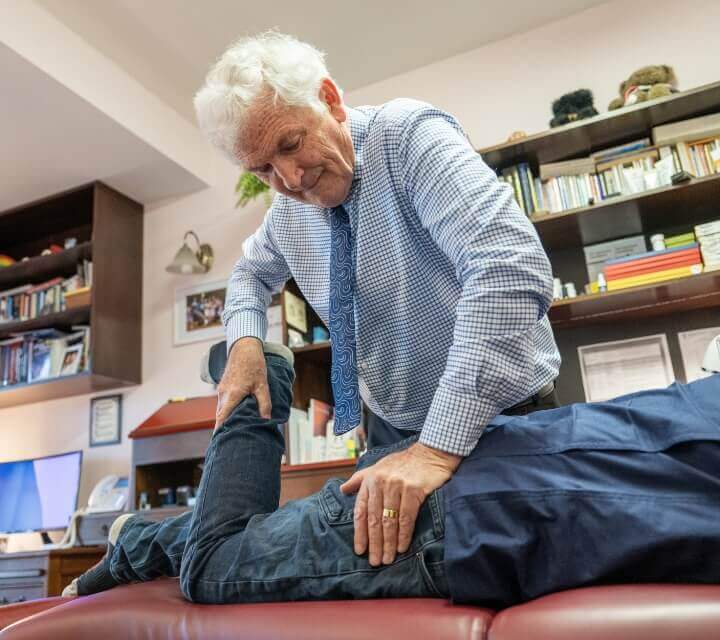 doctor adjusting patient