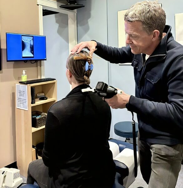 Chiropractor checking patient