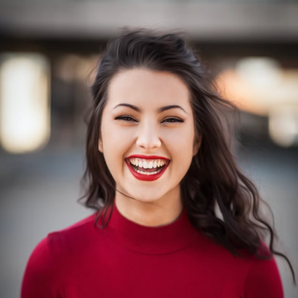 woman great smile wearing red tops