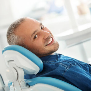 happy-man-in-dental-chair-sq1