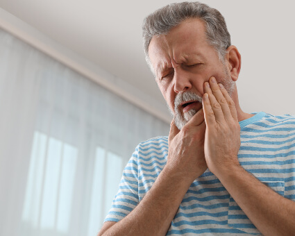 Man with pain from tooth decay