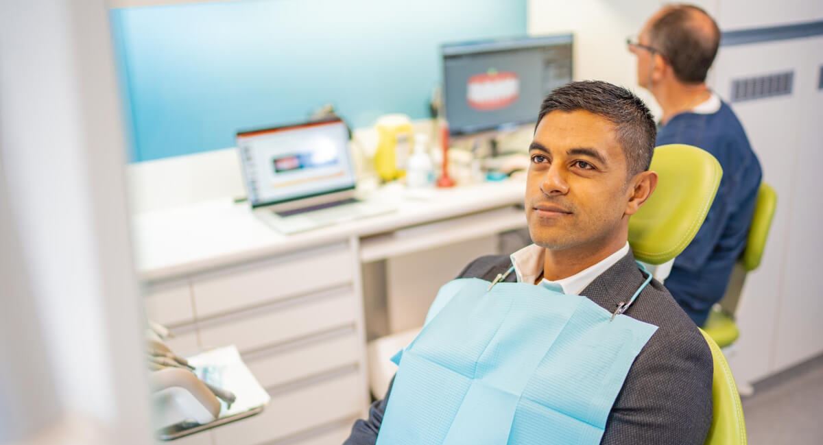 Sydney patient sitting on dental chair