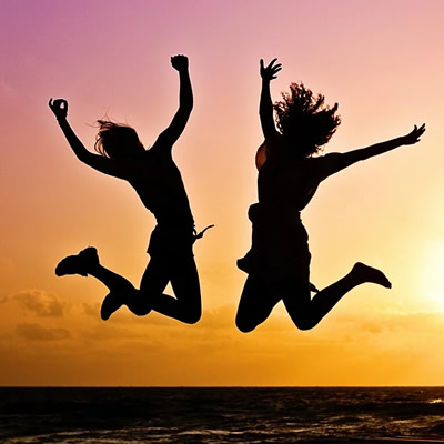 two people Jumpshot against sunset