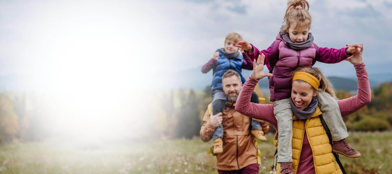 Family of four hiking outdoors