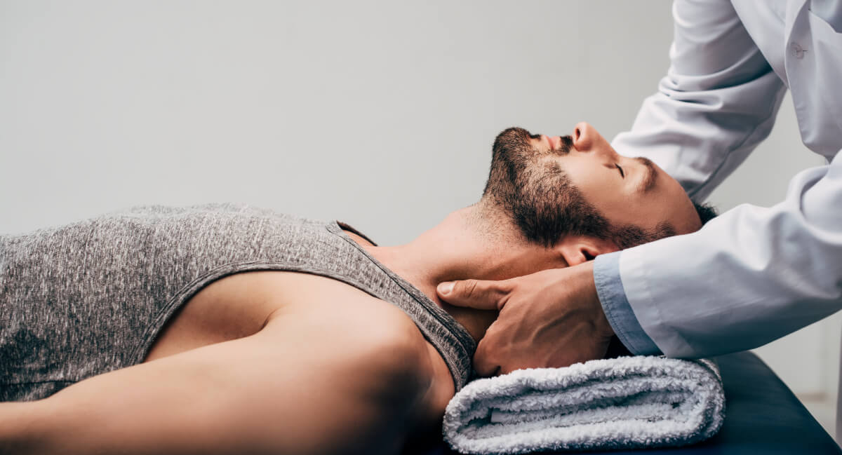 Male patient relaxed chiropractic adjustment