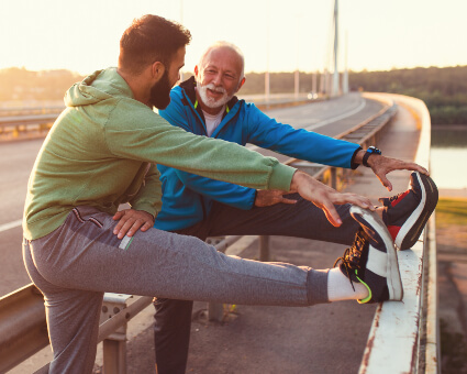 Two men stretching their legs