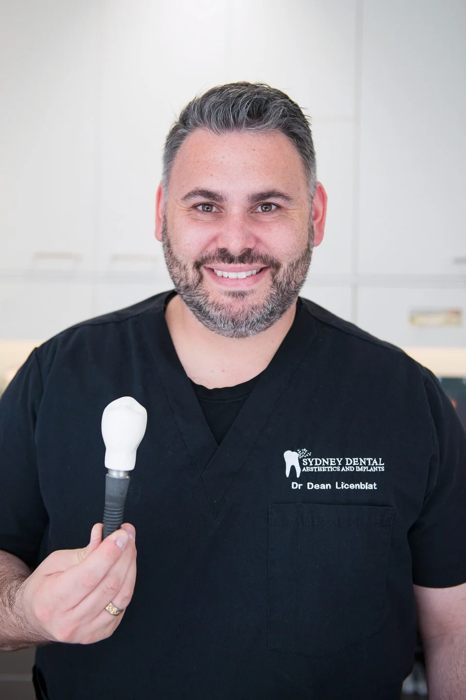 Dean-holding-implant-model.jpg