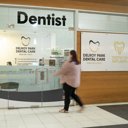 woman walking into clinic