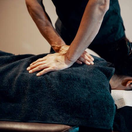 Chiropractor adjusting a female patient