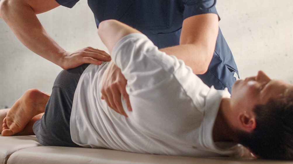 Patient receiving a chiropractic side adjustment
