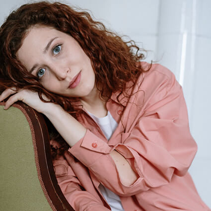 woman sitting leaning on chair