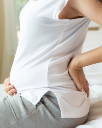 Pregnant lady wearing white shirt