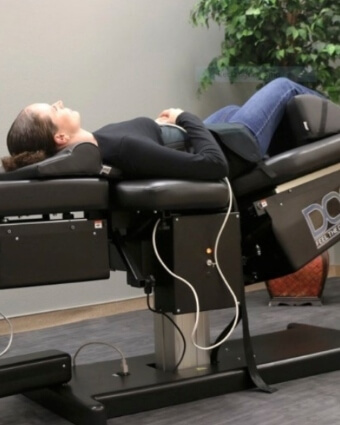 Female patient receiving Non-Surgical Spinal Decompression Therapy