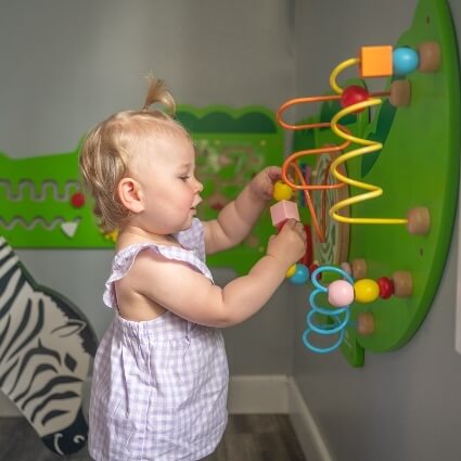 baby playing in our waiting area
