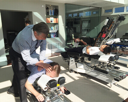 /pc chiropractor adjusting a patient