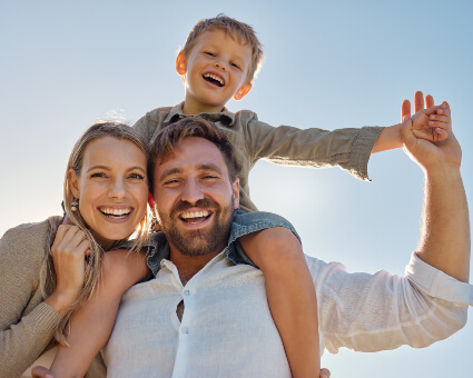 Smiling family of three