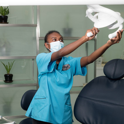 dental assistant in treatment room