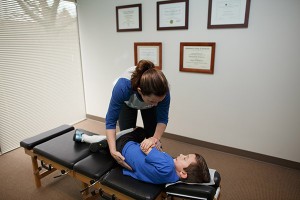 Dr Tiffany adjusting a young boy