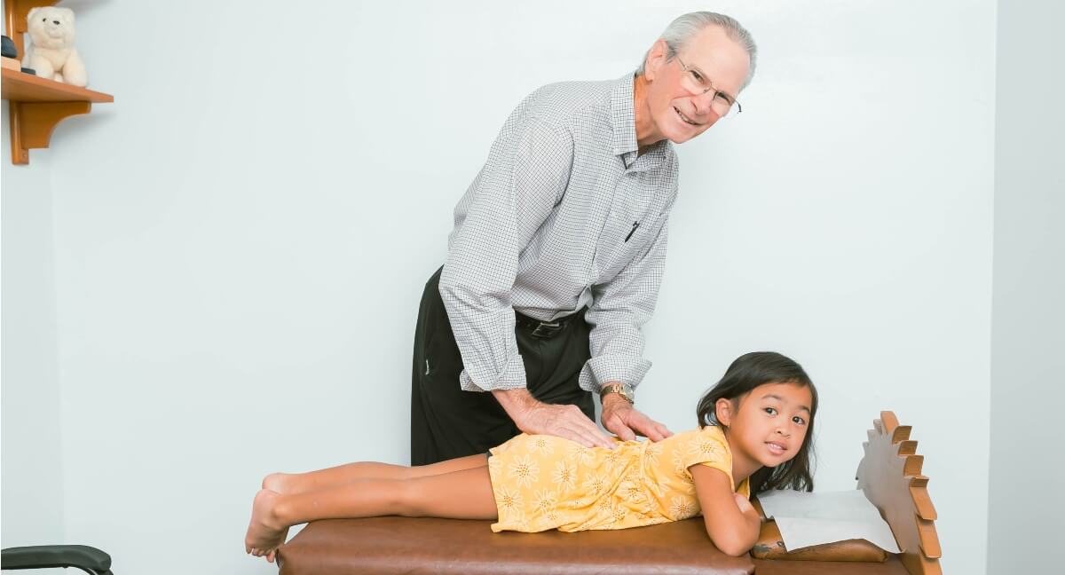 Anaheim chiropractor Dr. Maher adjusting pediatric patient