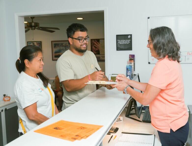 Majer Chiropractic Wellness Center staff member interacting with patients