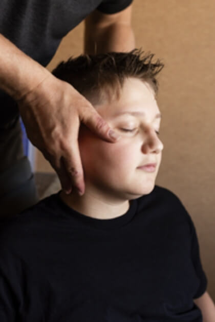child having neck adjusted