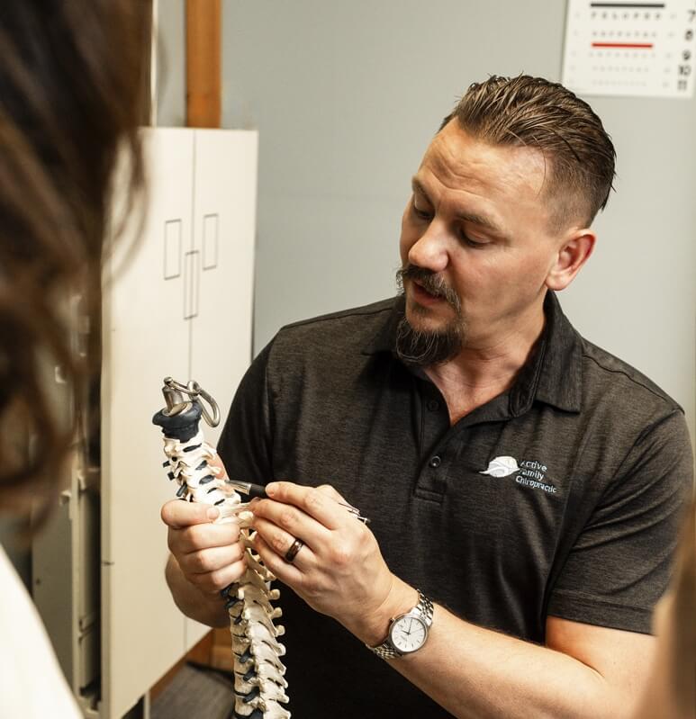 Mason City chiropractor Dr Trenary talking with patient