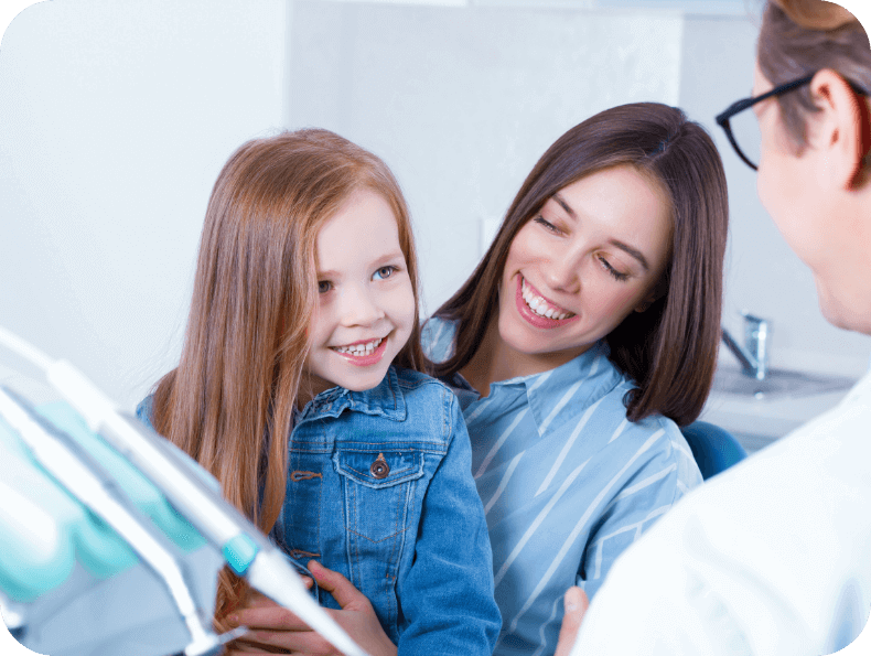 Child smiling in dental chair