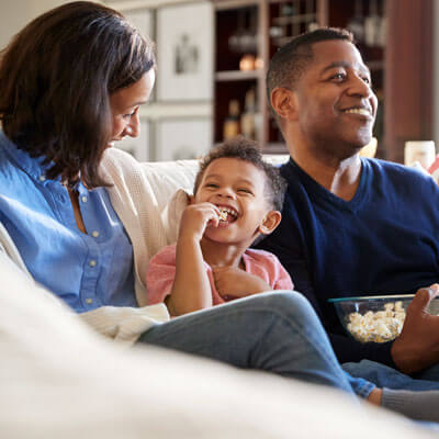 smiling family having a movie night