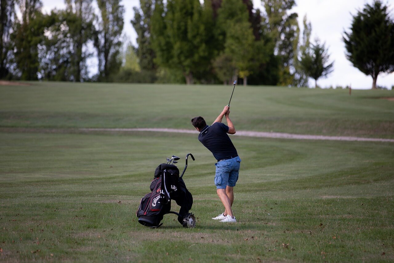 man golfing