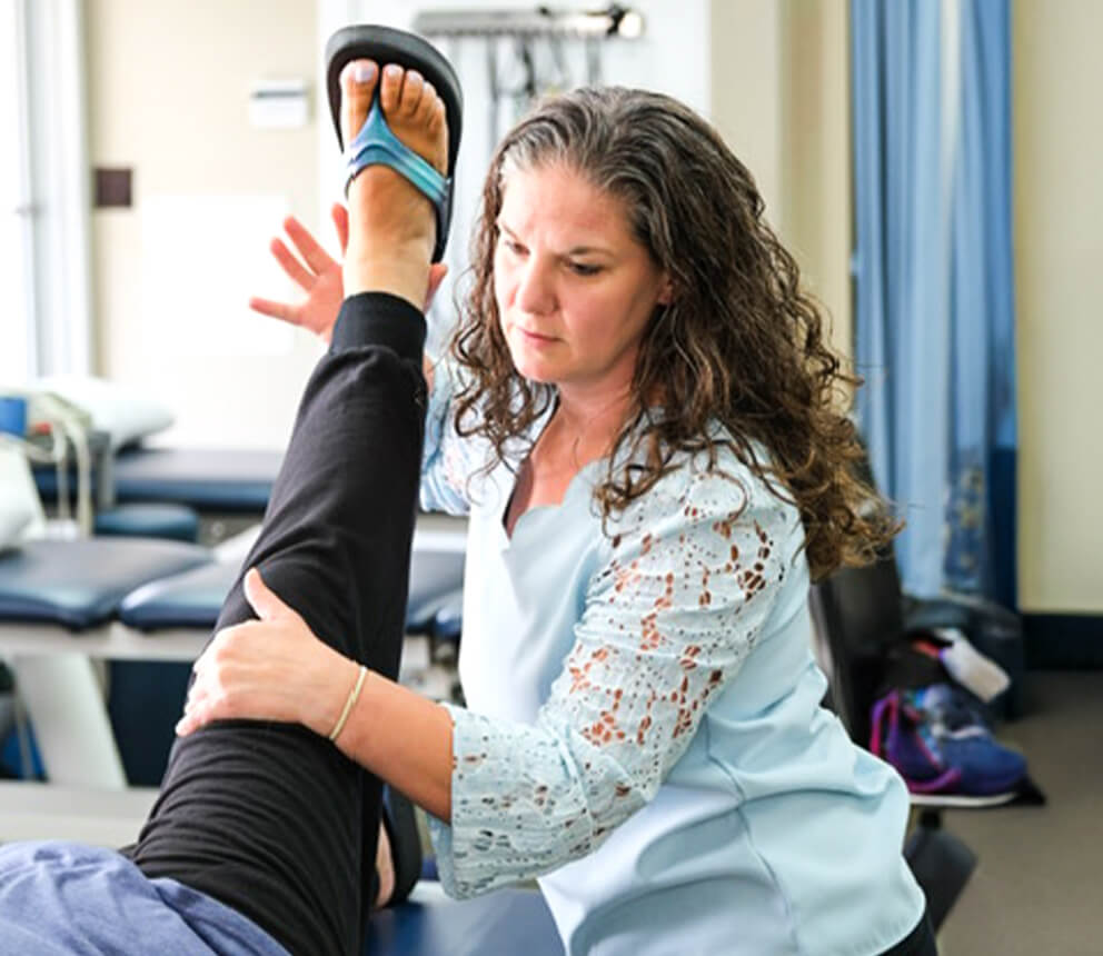 adjusting patient leg