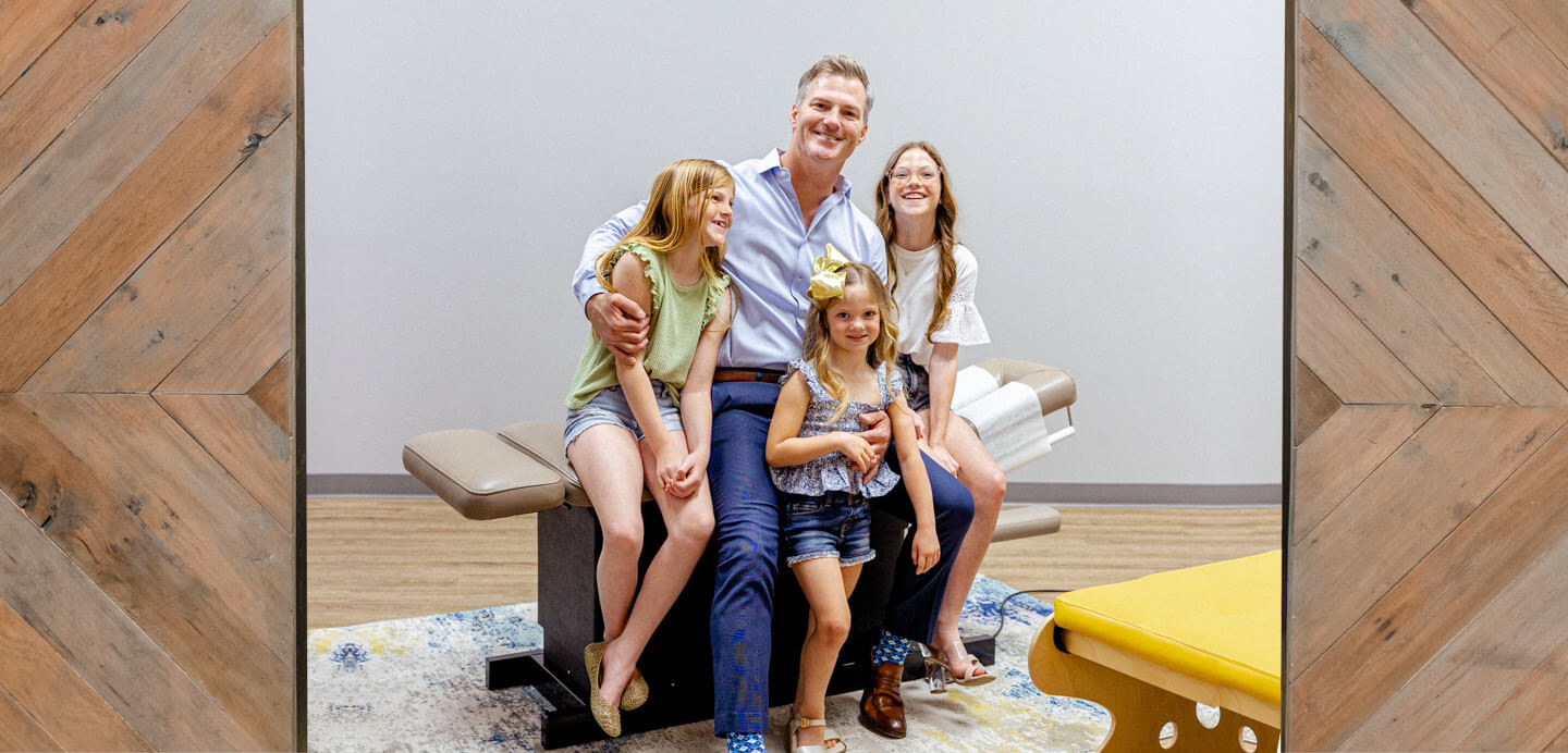 Dr. Judd with patient and family