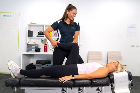 Dr Jill adjusting patients leg
