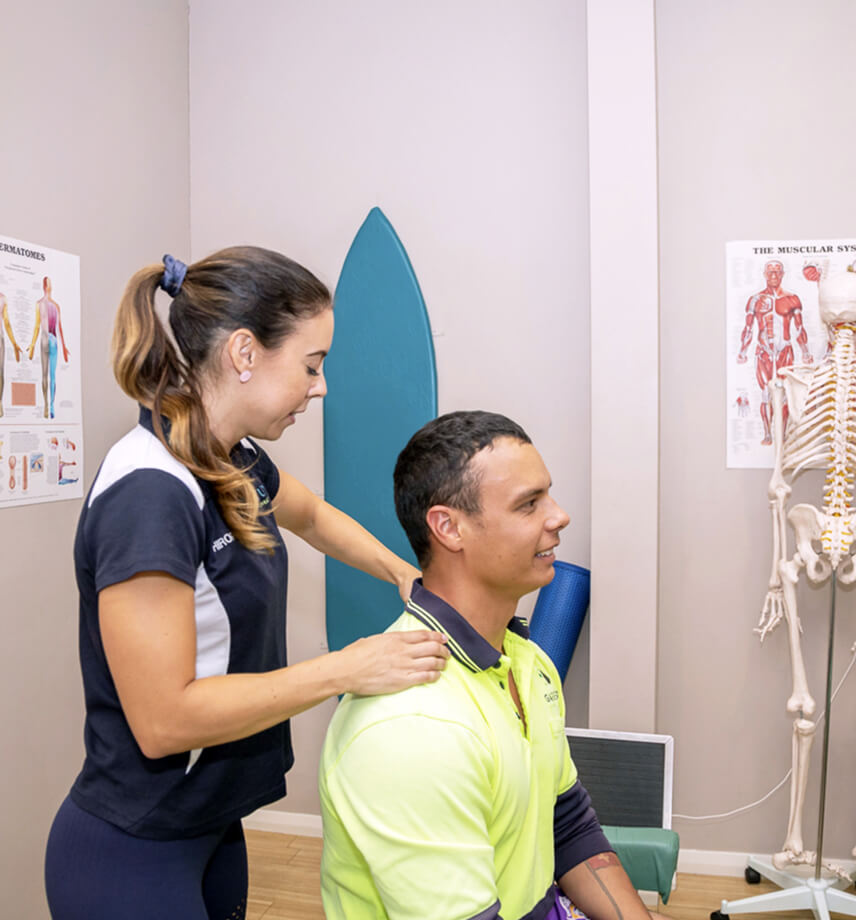 massaging man's shoulder