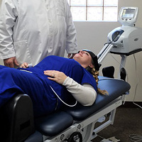 woman laying on chiropractic table