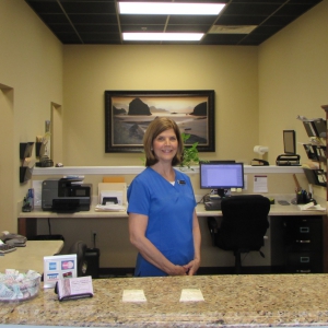 Vicky smiling at the front desk