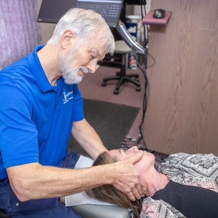 patient having neck adjusted