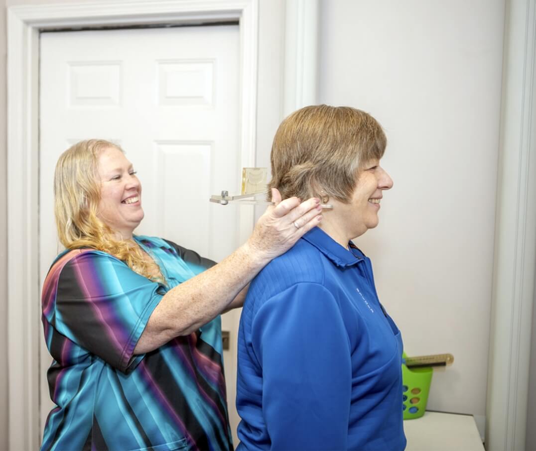 Lindsay team member checking patients neck