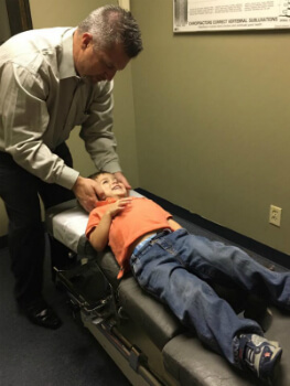 Dr. Peres adjusting a patient.