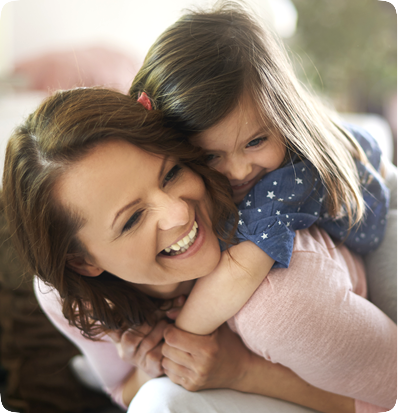 Woman and little girl smiling