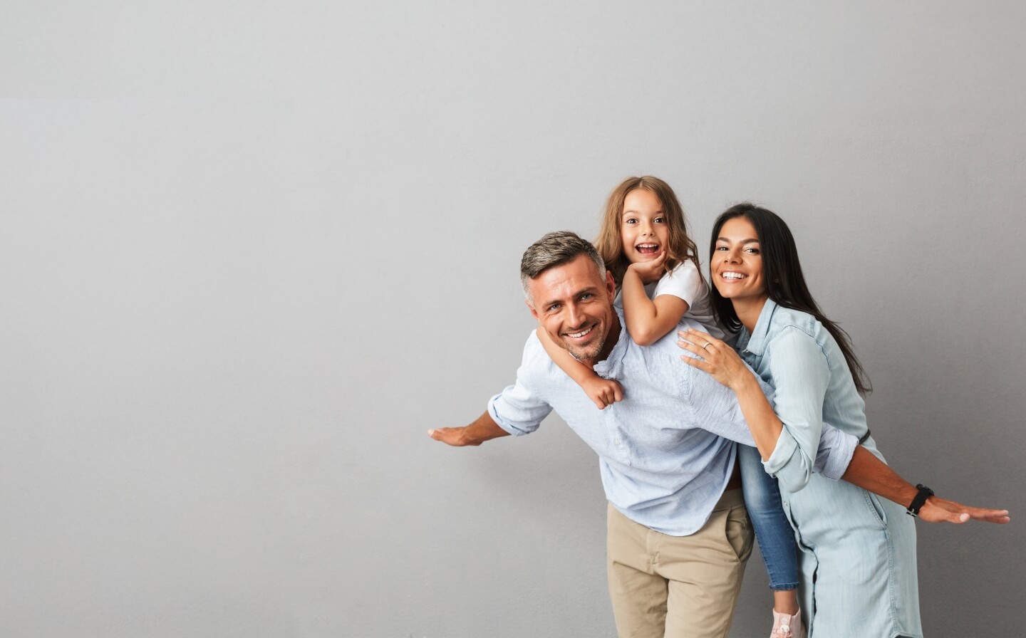 happy family of 3 smiling
