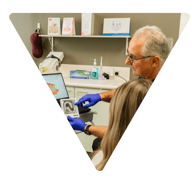 Dentist showing dental fixture