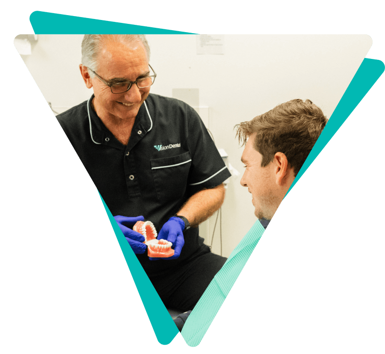 Dentist showing dentures