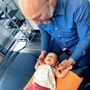 baby-girl-looking-up-at-doctor