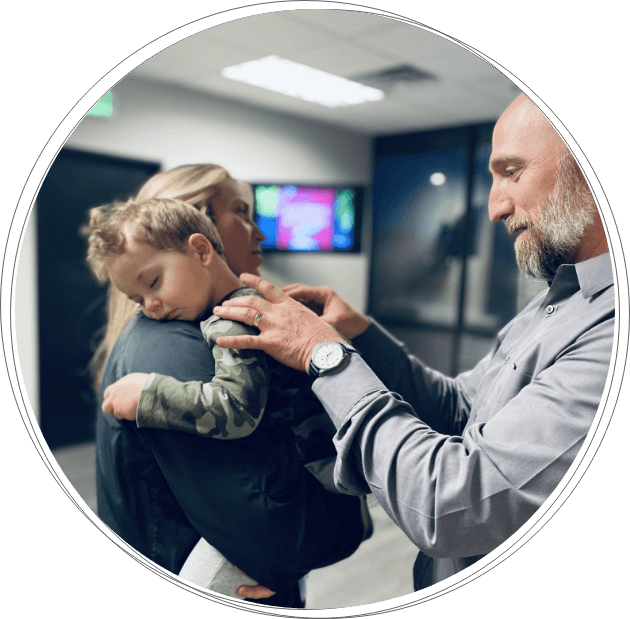 Chiropractor checking baby patient