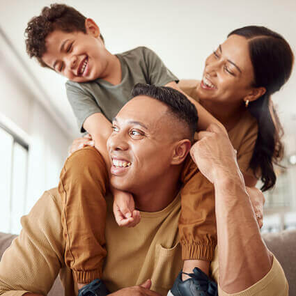 child on dads shoulder